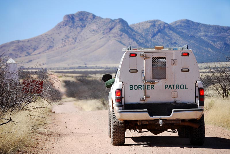 Border Patrol truck on dirt road
